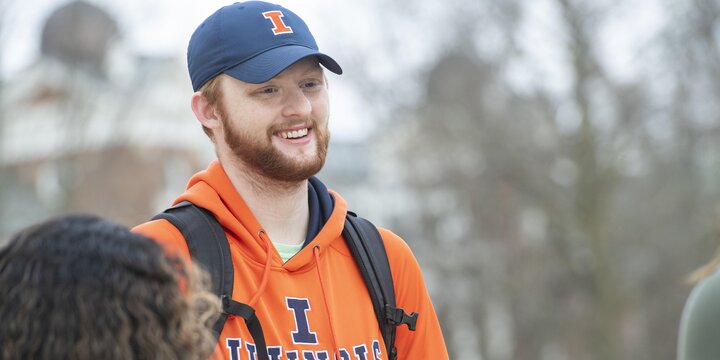 Student smiling in Illinois wear